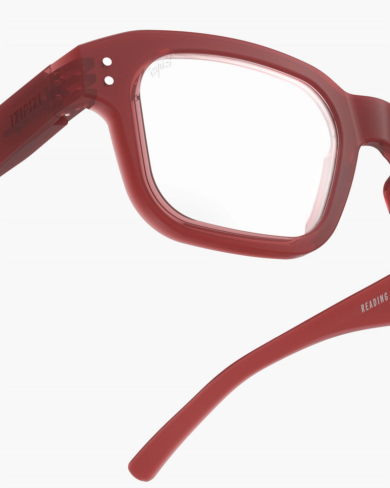 Red eyeglasses on a white background