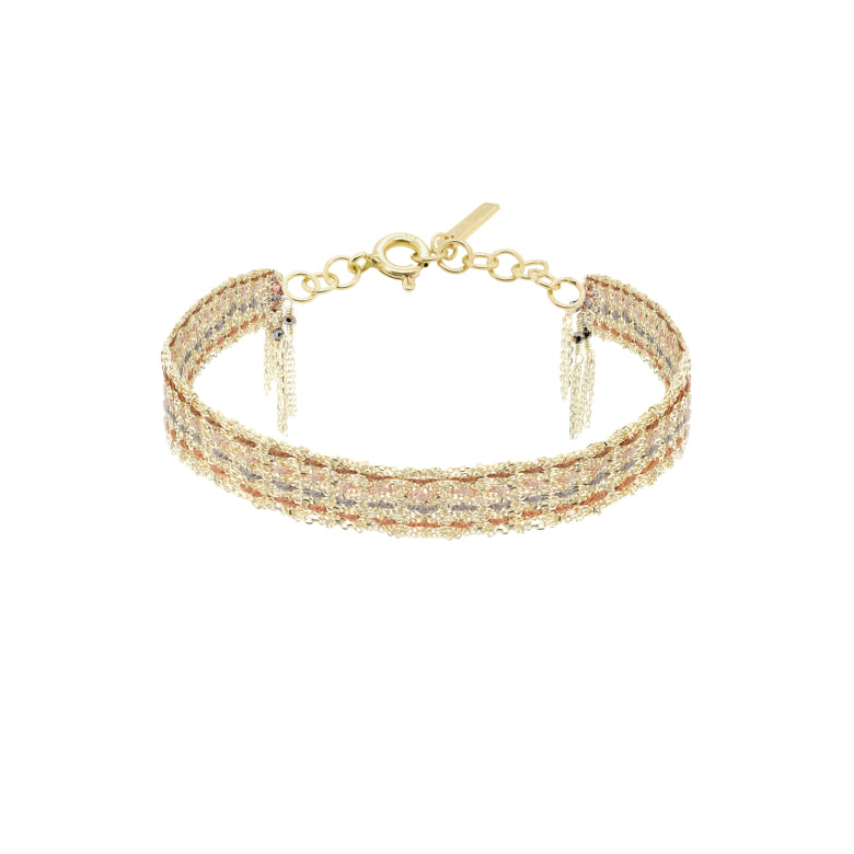 Gold bracelet with clear stones on a white background