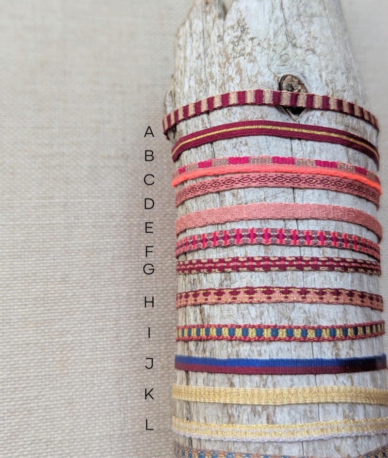 Set of woven bracelets on a textured surface

Guanabana woven bracelet jewelry store sowa boston gift shop small business boutique small gifts for her 