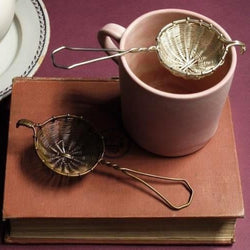 Bellocq brass tea strainer, designed to strain leaves from a larger pot into your cup. 