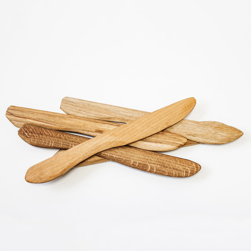 Hand carved from the wood scraps of larger cutting boards, these little wood spreaders are cut in the shape of a knife and are great to use with dips or jams. Each is unique.