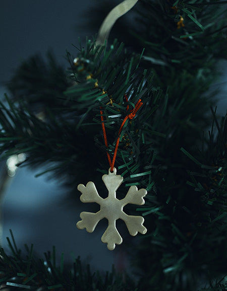 Fog Linen brass snowflake ornament. Shop Boston