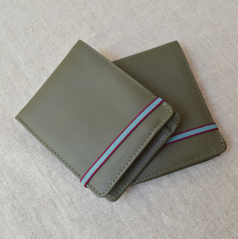 Carre Royal Kaki Minimalist Wallet With Coin Pocket has slots and pockets for cards and notes. Snap coin purse inside. Waterproof calfskin and vegetal tanned leathers. Made in France. 
