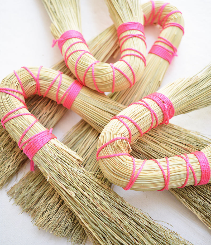 Double hand broom with neon pink nylon looping. by Sunhouse Craft. Handwoven in Kentucky.  