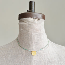 Turquoise half moon talisman necklace by River Song jewelry. 24k gold over sterling silver. 