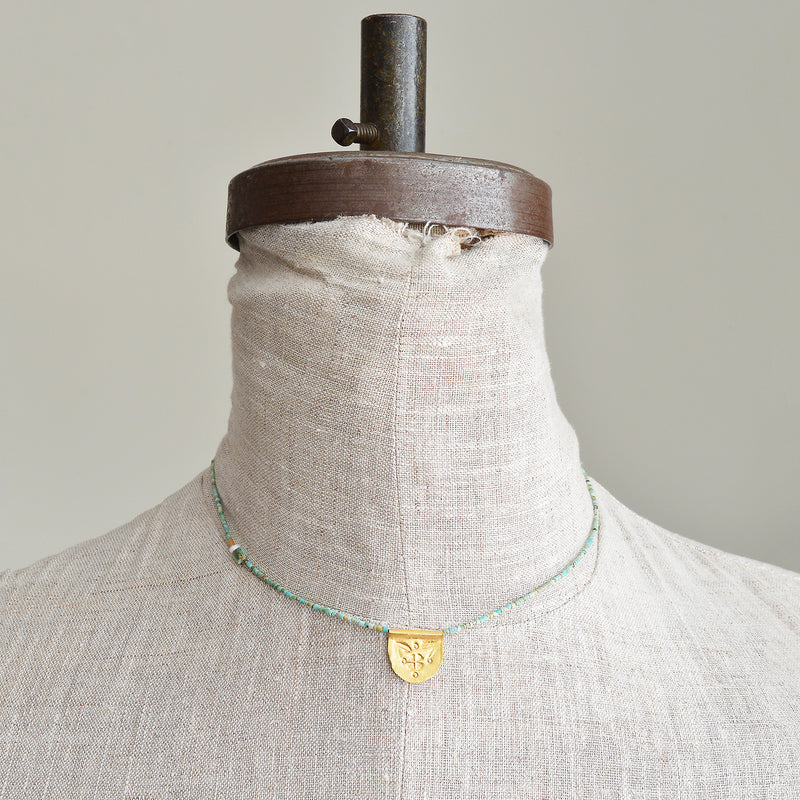 Turquoise half moon talisman necklace by River Song jewelry. 24k gold over sterling silver. 