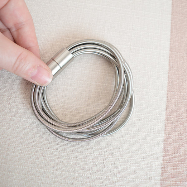 La Mollla twist stainless steel bracelet - made in France from Italian industrial wire. Designed by Italian architect and product designer Tiziana Redavid.