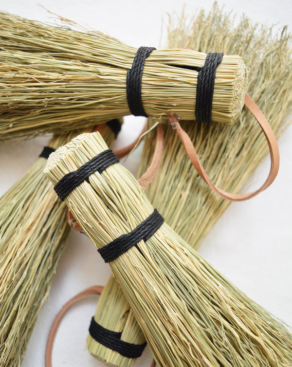 Great simple brush for whisking away dirt or debris from the garden or cleaning up dried mud off of shoes. Black hemp cord and leather tie for hanging. Handmade in Kentucky by designer/maker Cynthia Main of Sunhouse Craft.