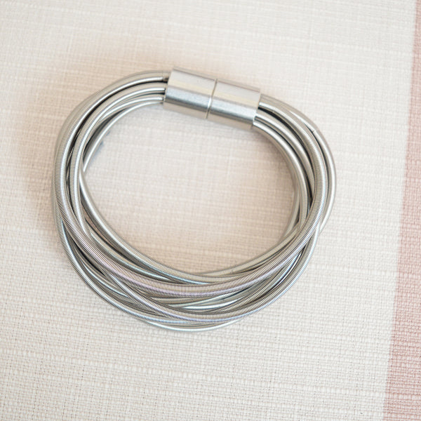 La Mollla twist stainless steel bracelet - made in France from Italian industrial wire. Designed by Italian architect and product designer Tiziana Redavid.