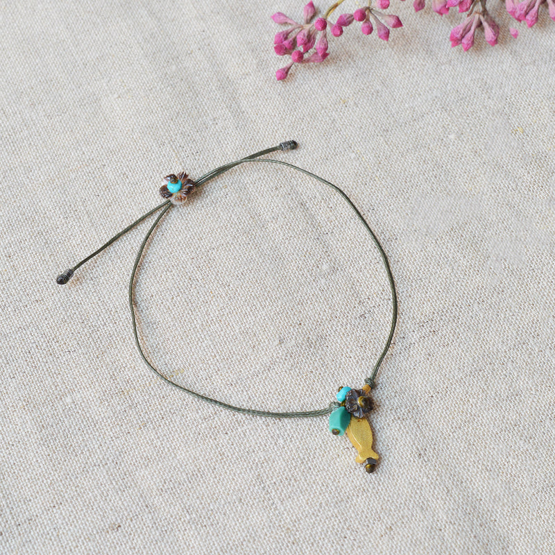 Golden fish bracelet with pearl and turquoise beads. 7" adjustable nylon cord jewelry River Song Shop Boston