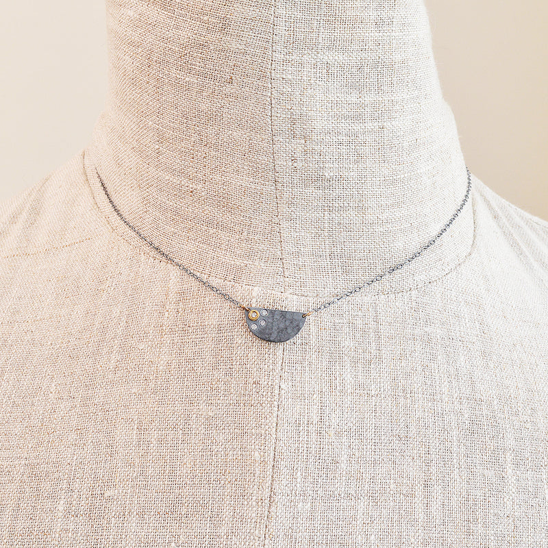 Nikki Nation oxidized silver and 18K gold callisto necklace. 