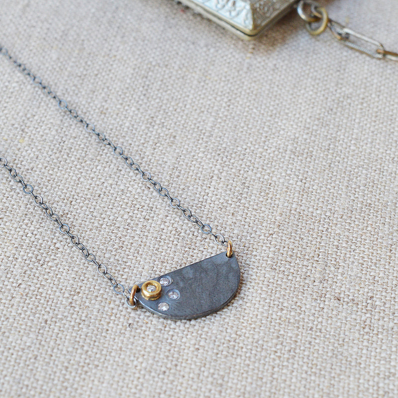 Nikki Nation oxidized silver and 18K gold callisto necklace. 