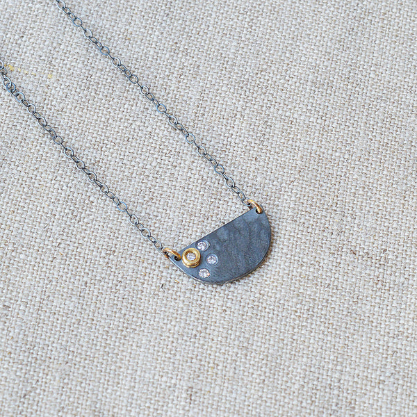 Nikki Nation oxidized silver and 18K gold callisto necklace. 