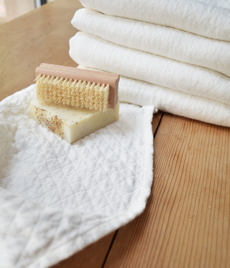 Wonderfully textured for gentle exfoliation and maximum absorbency, these quick-drying and durable diamond weave  towels are  woven from two layers of medium-weight, undyed 100% linen yarns. Whitened without the use of chlorine bleach.  Towels will arrive pressed and take on a quilted appearance after machine wash and dry, becoming softer with use.  For greater exfoliation, hang to dry.