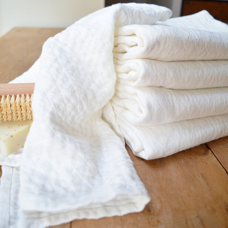 Wonderfully textured for gentle exfoliation and maximum absorbency, these quick-drying and durable diamond weave  towels are  woven from two layers of medium-weight, undyed 100% linen yarns. Whitened without the use of chlorine bleach.  Towels will arrive pressed and take on a quilted appearance after machine wash and dry, becoming softer with use.  For greater exfoliation, hang to dry.