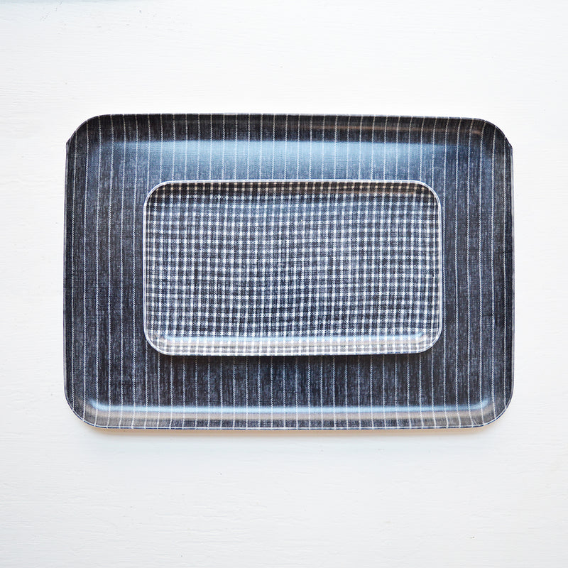 Fog Linen  light-weight serving trays made from linen that has been covered in a poly resin.  