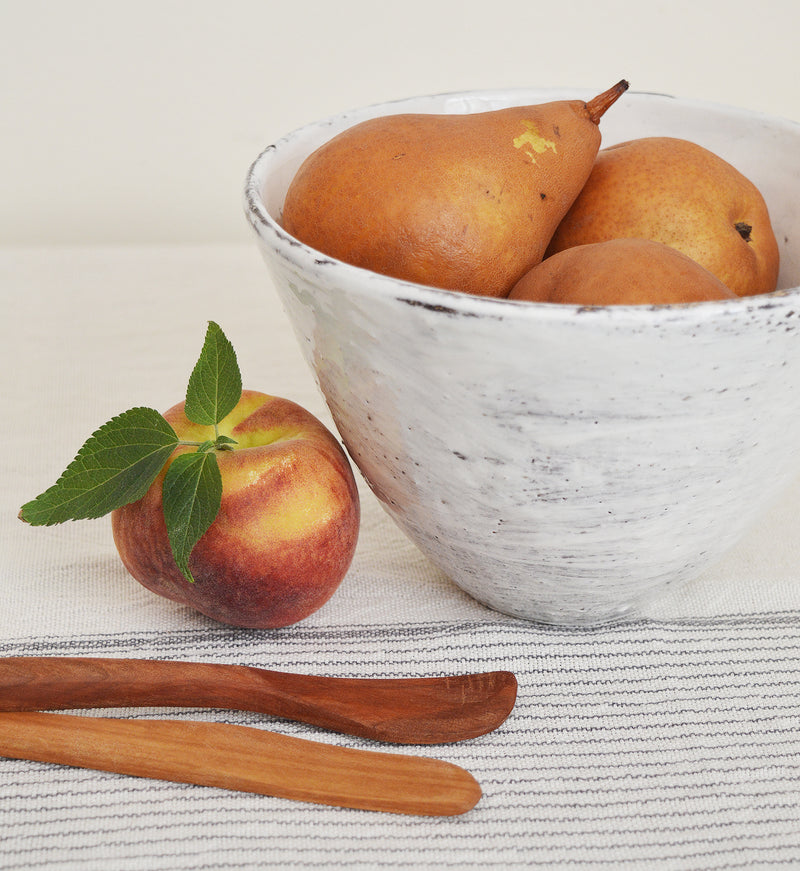 Tall white bowls by Boston artist Florence Penault. Ideal for eating ramen or a big salad but they also make good serving bowls for a side dish.