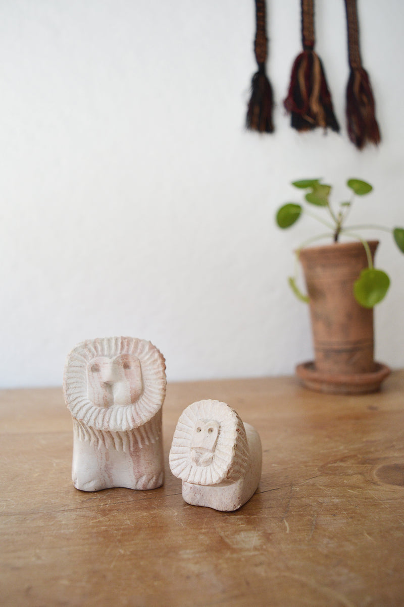 MCM Mid century modern  hand carved limestone travertina sculptures of a lion and her cub. 