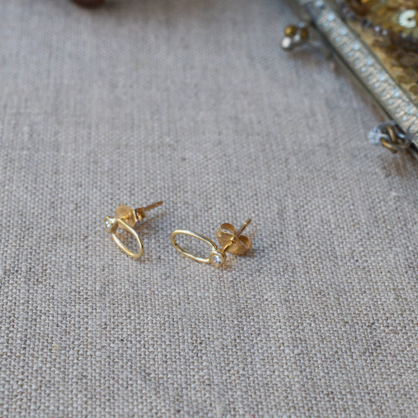 Lio and Linn 14K gold diamond sun shower studs. 