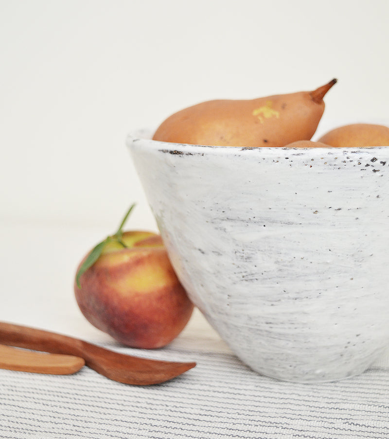 Tall white bowls by Boston artist Florence Penault. Ideal for eating ramen or a big salad but they also make good serving bowls for a side dish.