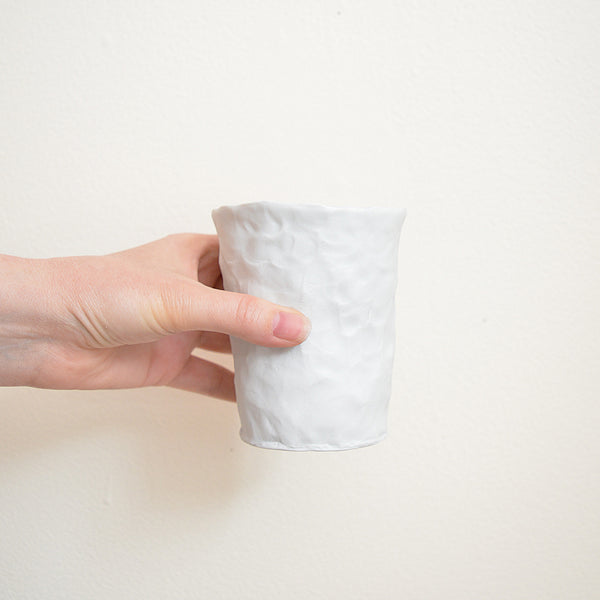 Hand pinched porcelain tumbler by Maine potter Ingrid Bathe. Available in Boston shop.