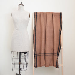 Soft and cozy 100% wool khadi (homespun yarn and handwoven) throw in a warm caramel color with simple black border.