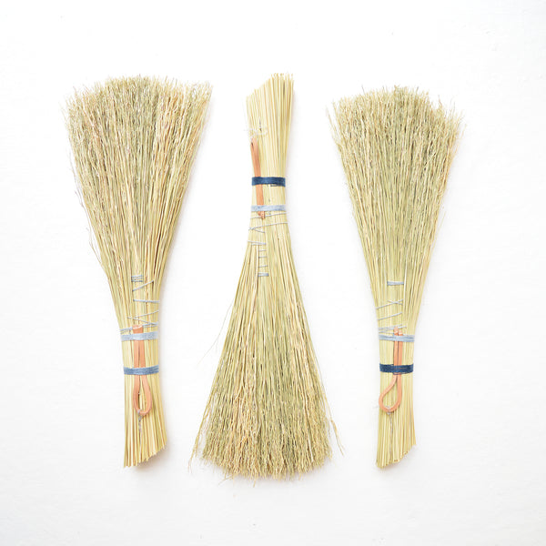 Simple hand broom with contrasting blue and grey linen ties. Handmade in Kentucky by designer/maker Cynthia Main of Sunhouse Craft.