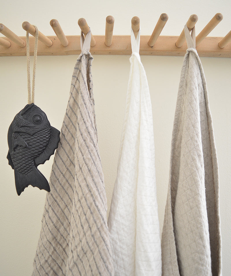 Wonderfully textured for gentle exfoliation and maximum absorbency, these quick-drying and durable diamond weave  towels are  woven from two layers of medium-weight, undyed 100% linen yarns. Whitened without the use of chlorine bleach.  Towels will arrive pressed and take on a quilted appearance after machine wash and dry, becoming softer with use.  For greater exfoliation, hang to dry.