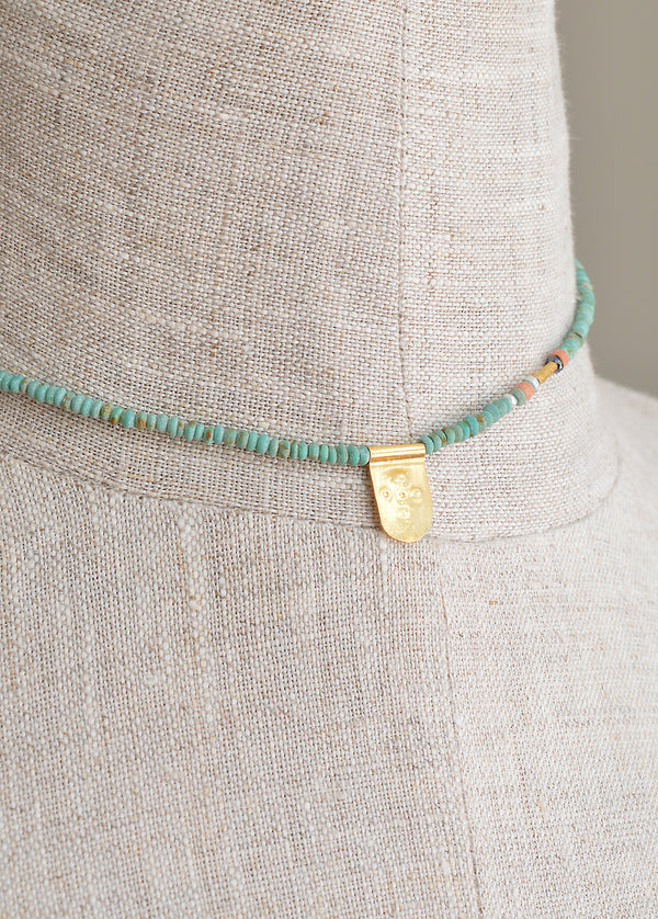 Tab Talisman on Tiny Turquoise Bead Necklace with Black Diamond Detail