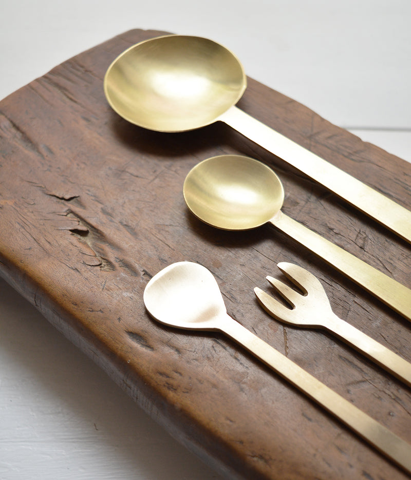 Hand-hammered brass spoons with a matte finish. Perfect as serving utensils and they make wonderful house-warming gifts. As each is hand-made, surfaces may not be uniform. 