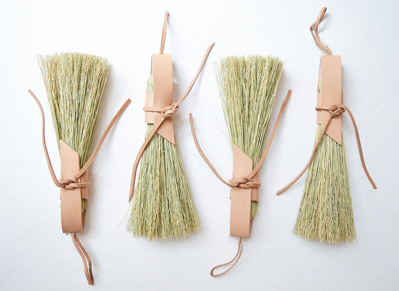 Simple broom wrapped in natural veg tan leather.  Handmade in Kentucky by designer/maker Cynthia Main of Sunhouse Craft.  