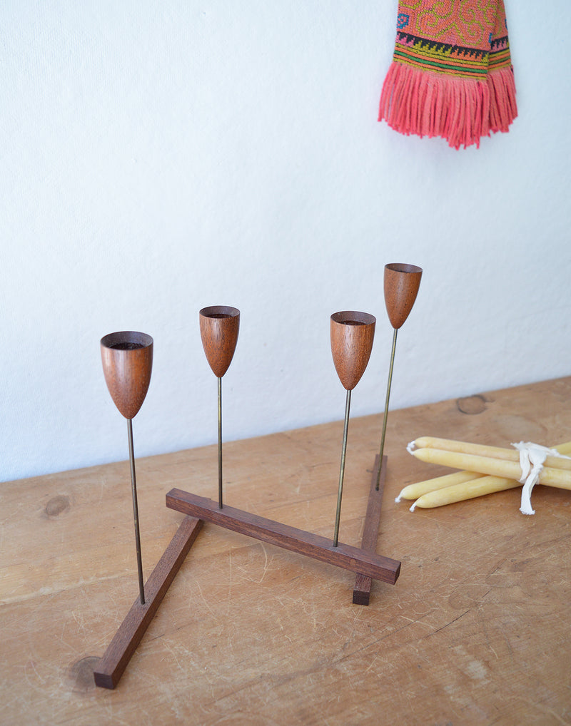 Vintage mid century modern foldable, articulated, candle holder. Made of teak wood and metal. 