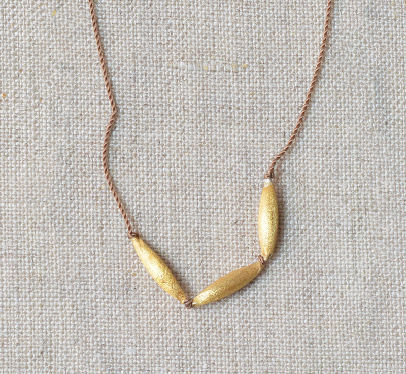 Hand-stamped talisman necklace River Song jewelry 24k gold over sterling silver shop boston