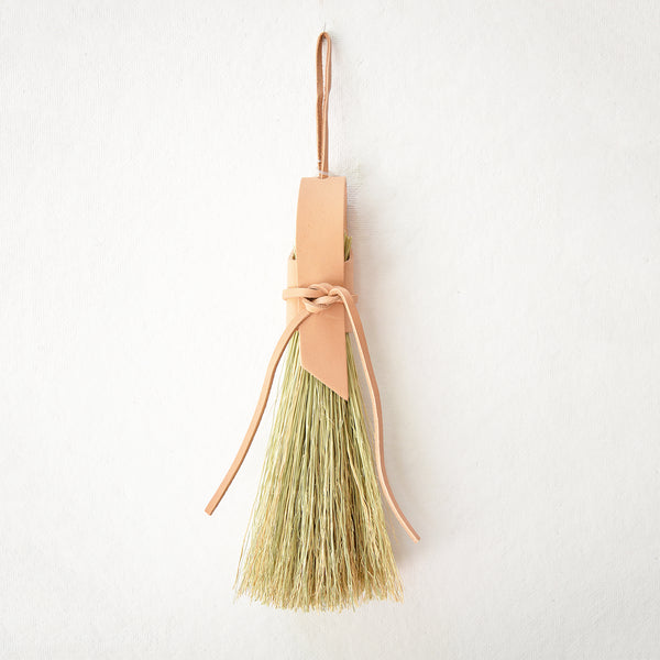 Simple broom wrapped in natural veg tan leather.  Handmade in Kentucky by designer/maker Cynthia Main of Sunhouse Craft.  