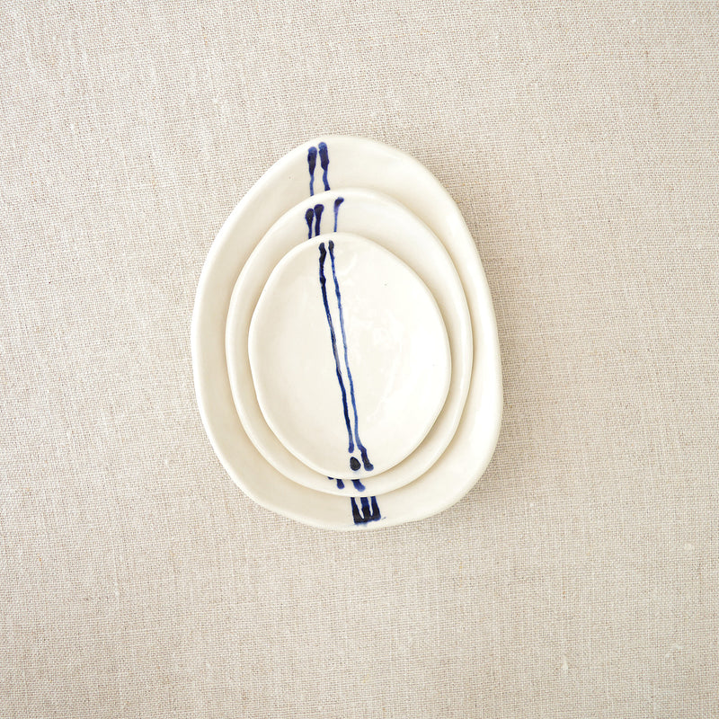 Ceramic nesting trinket dishes handmade and hand painted by Boathouse Pottery in Maine. 