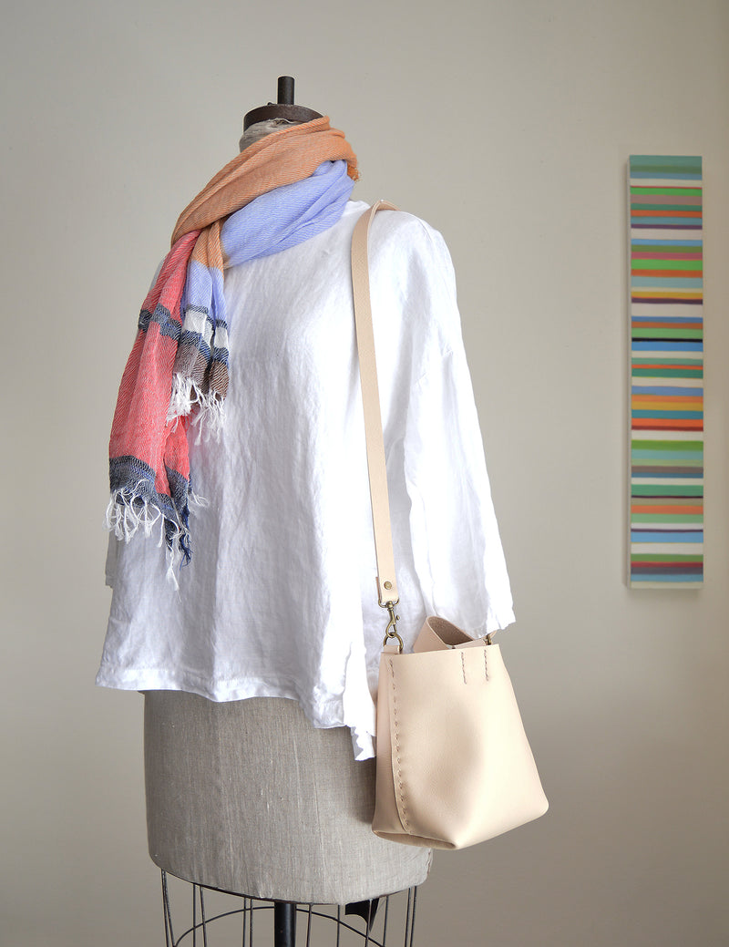 Stitch and Tickle mini bucket tote handmade of soft, medium weight, vegetable tanned leather. The leather will darken beautifully with age. Hand sewn. Made in Boston.