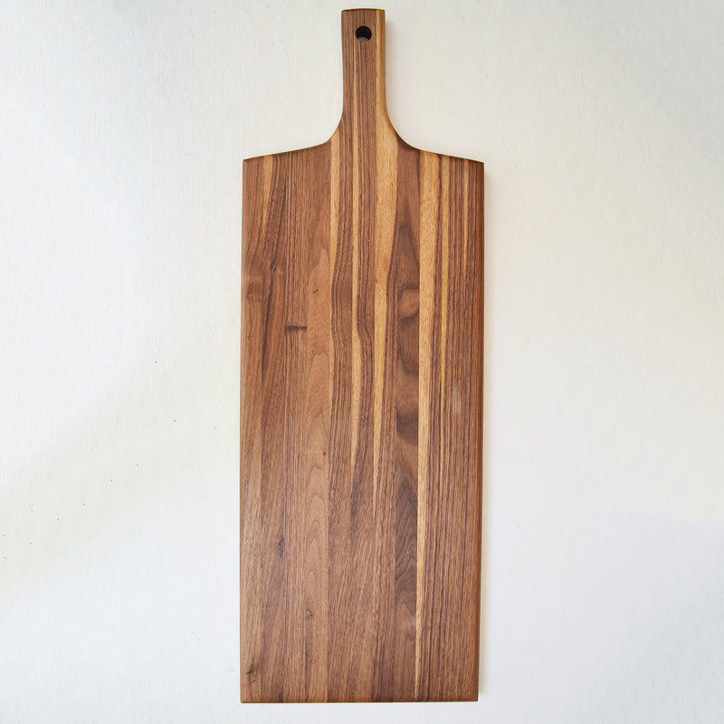 Beautiful spalted maple wood board, to serve charcuterie or to use for cutting. The large hole allows easy hanging when not in use. Handmade to last  in the U.S.  from sustainably sourced American lumber. 