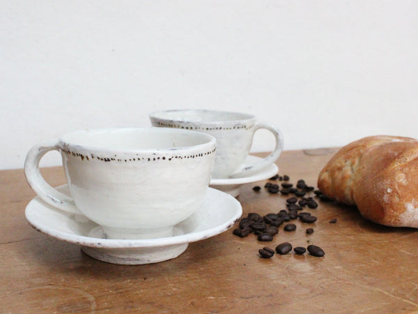 Handmade cup and saucer with dots. Shop Boston