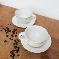 Handmade cup and saucer with dots. Shop Boston