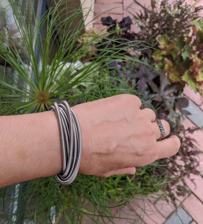 La Mollla twist stainless steel bracelet - made in France from Italian industrial wire. Designed by Italian architect and product designer Tiziana Redavid.