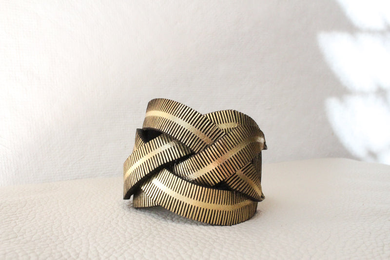 Fringe over bracelet in gold, silver, black. Shop Boston
