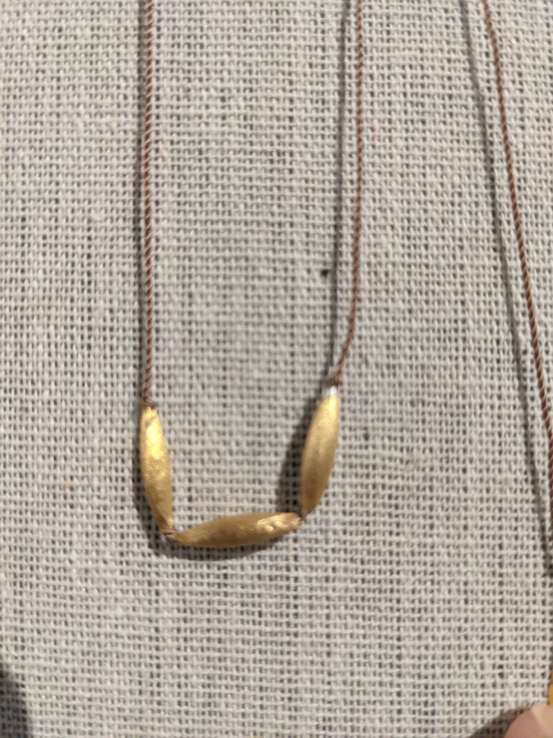 Hand-stamped talisman necklace River Song jewelry 24k gold over sterling silver shop boston